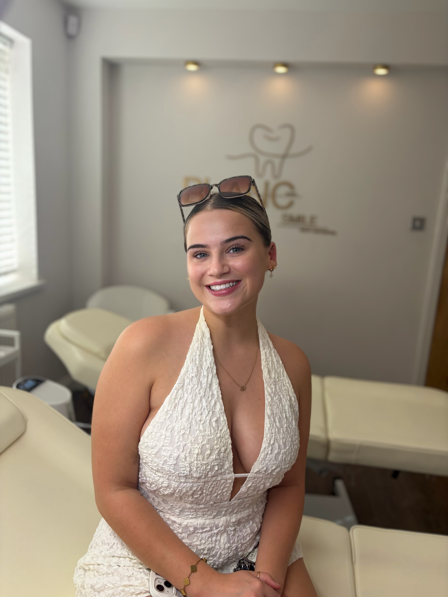 Happy client holding her Blanc Smile aftercare bag